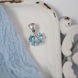 14k white gold with blue topaz stones